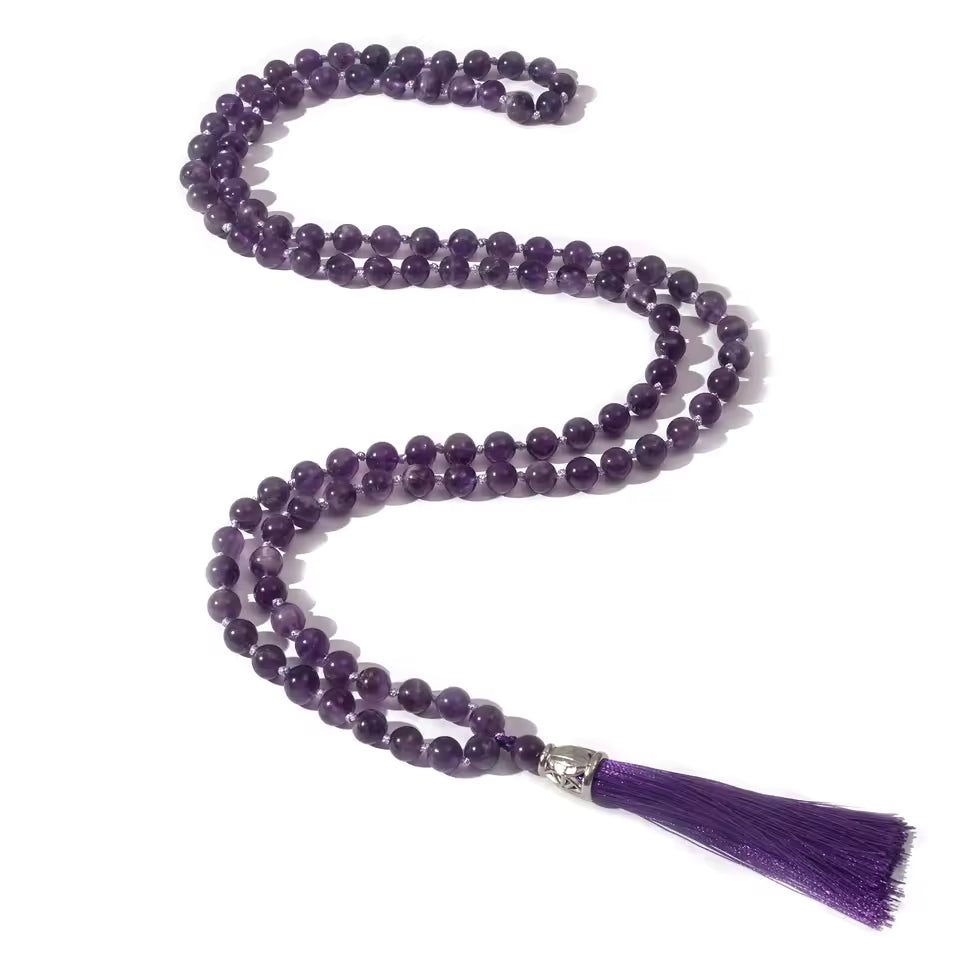 108 bead amethyst necklace on white background
