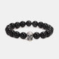 925 sterling silver skull bead bracelet with polished black stones, circular view
