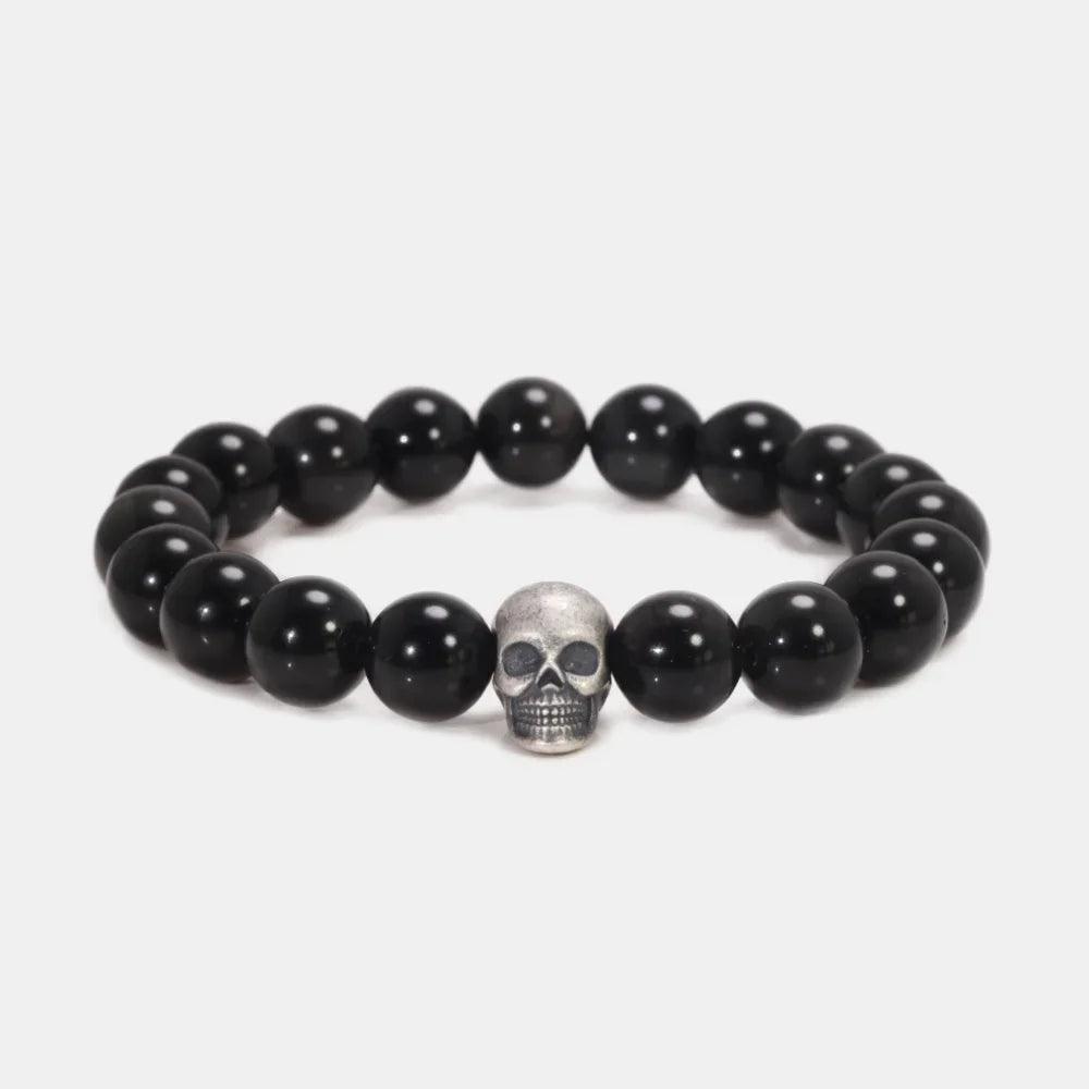 925 sterling silver skull bead bracelet with polished black stones, circular view