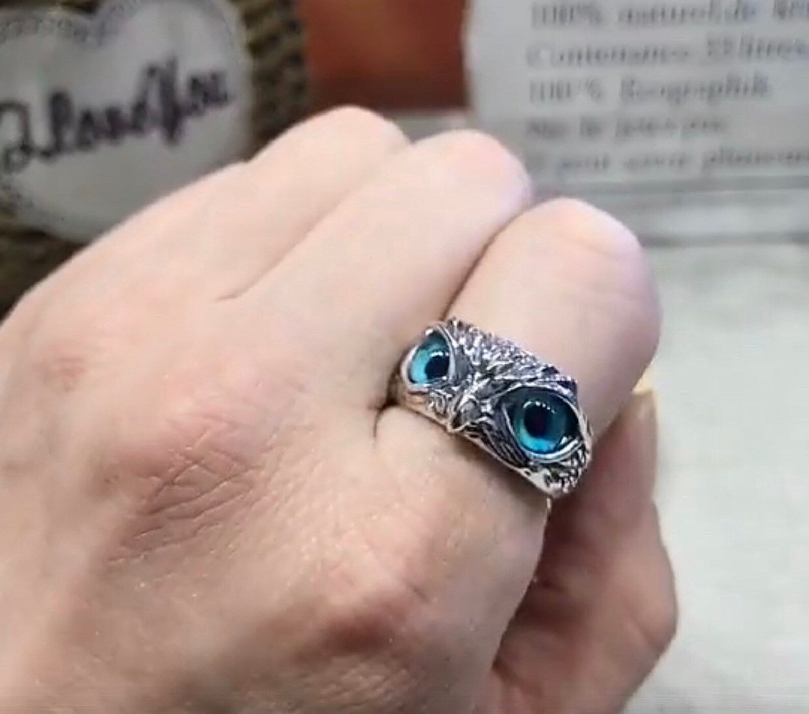 Adjustable owl ring shown on hand