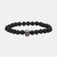 Black lava stone bead bracelet with a 925 sterling silver skull bead