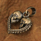 Brass skull heart pendant side view