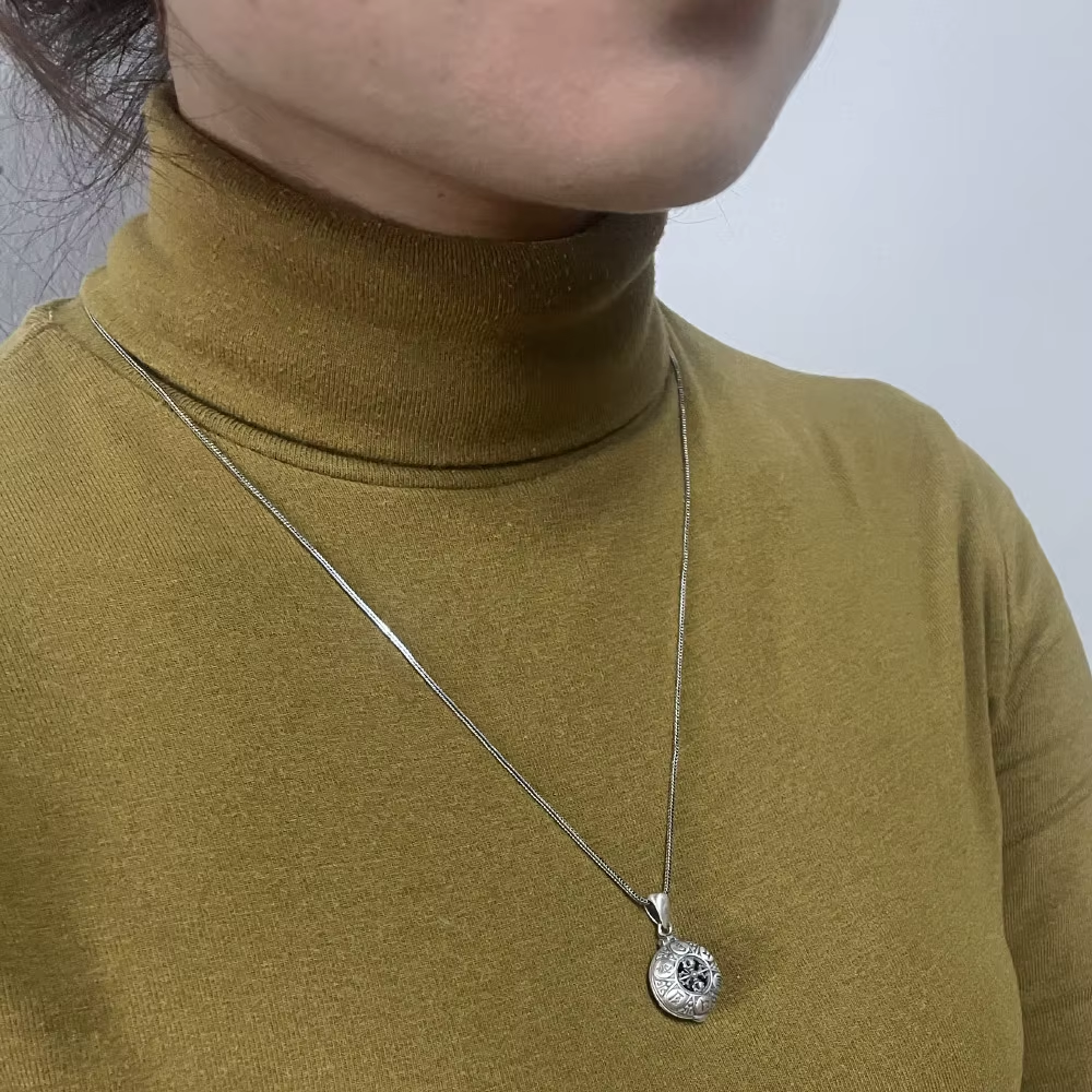 Buddhist locket necklace worn on neck