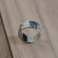 Buddhist silver ring with lucky clouds side angle
