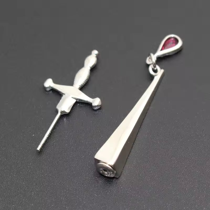 Cesare’s Veto sword blood earring close up