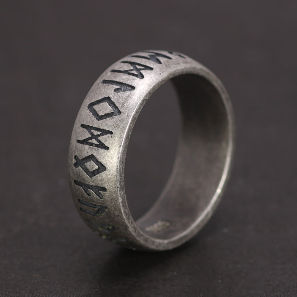 Close-up of Viking silver rune ring