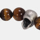 Close-up of the 925 sterling silver skull bead and tiger’s eye stones