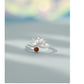 Close up of lotus flower ring with red gemstone