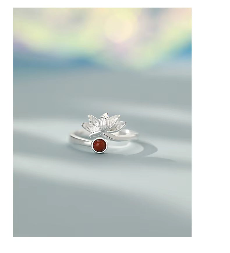 Close up of lotus flower ring with red gemstone