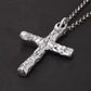 Close up of the textured sterling silver cross pendant