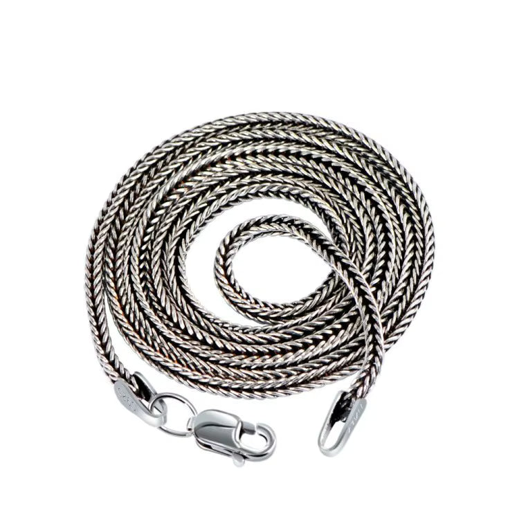 Close up texture view of 3mm spiga link necklace white background