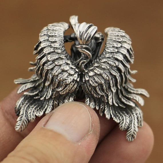 Detailed feather wings on erotic gothic woman angel silver necklace