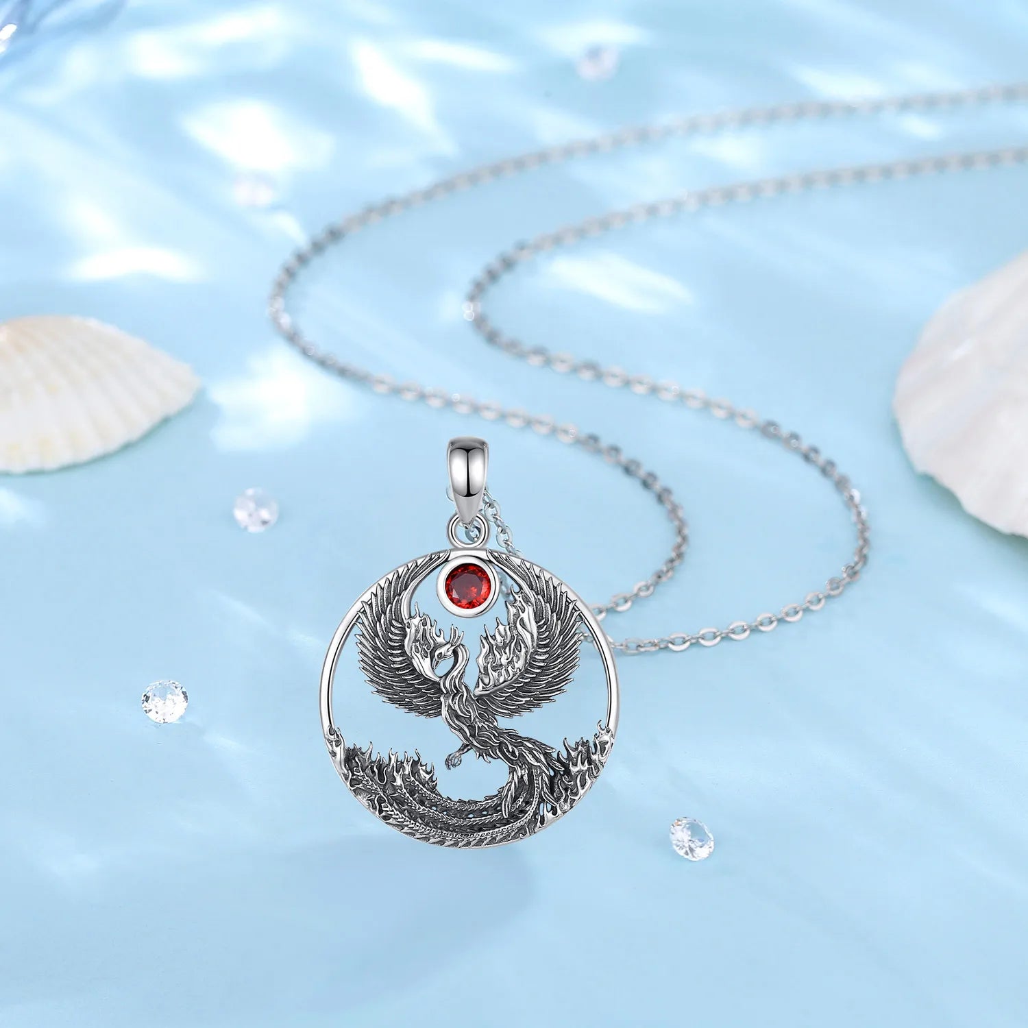 Detailed phoenix pendant with red gemstone front view