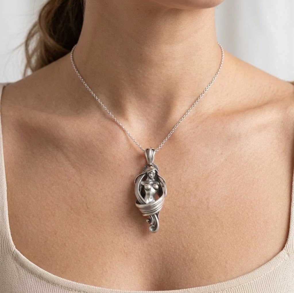 Detailed sterling silver Art Nouveau mermaid pendant necklace for women worn on a delicate chain.