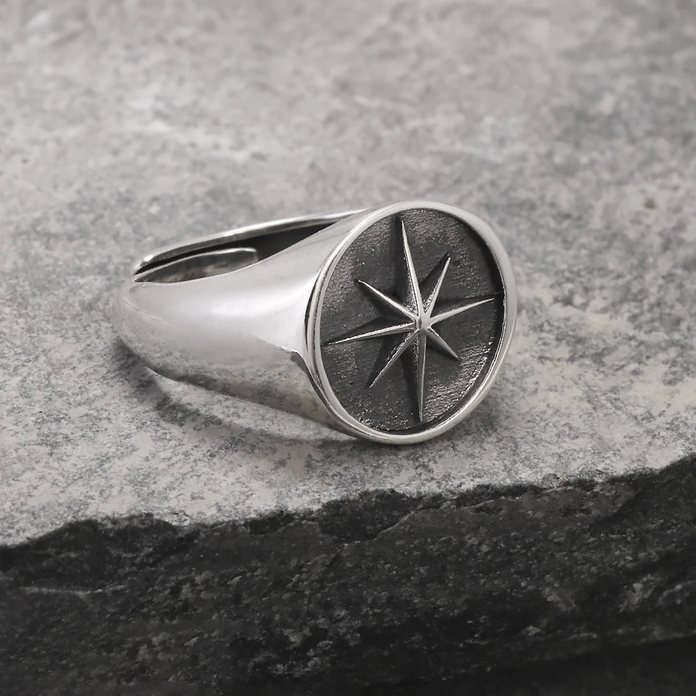 Front close up profile of oxidized silver North Star signet ring
