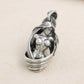 Front view of solid 925 sterling silver nude goddess pendant on light background