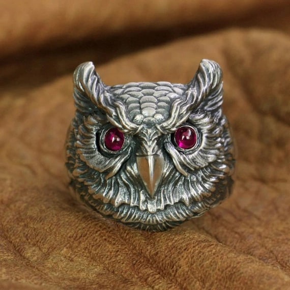 Handcrafted owl ring with pink zirconia eyes close-up