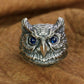 Handcrafted sterling silver owl ring with blue zirconia eyes