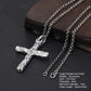 Large textured silver cross pendant necklace with chain displayed on a dark surface