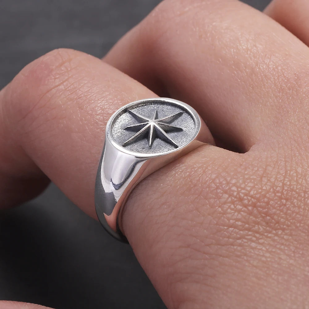 Men North Star signet ring close up detail worn on index finger