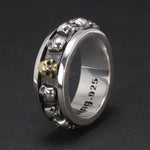 Men’s 925 sterling silver skull spinner ring with gold accent