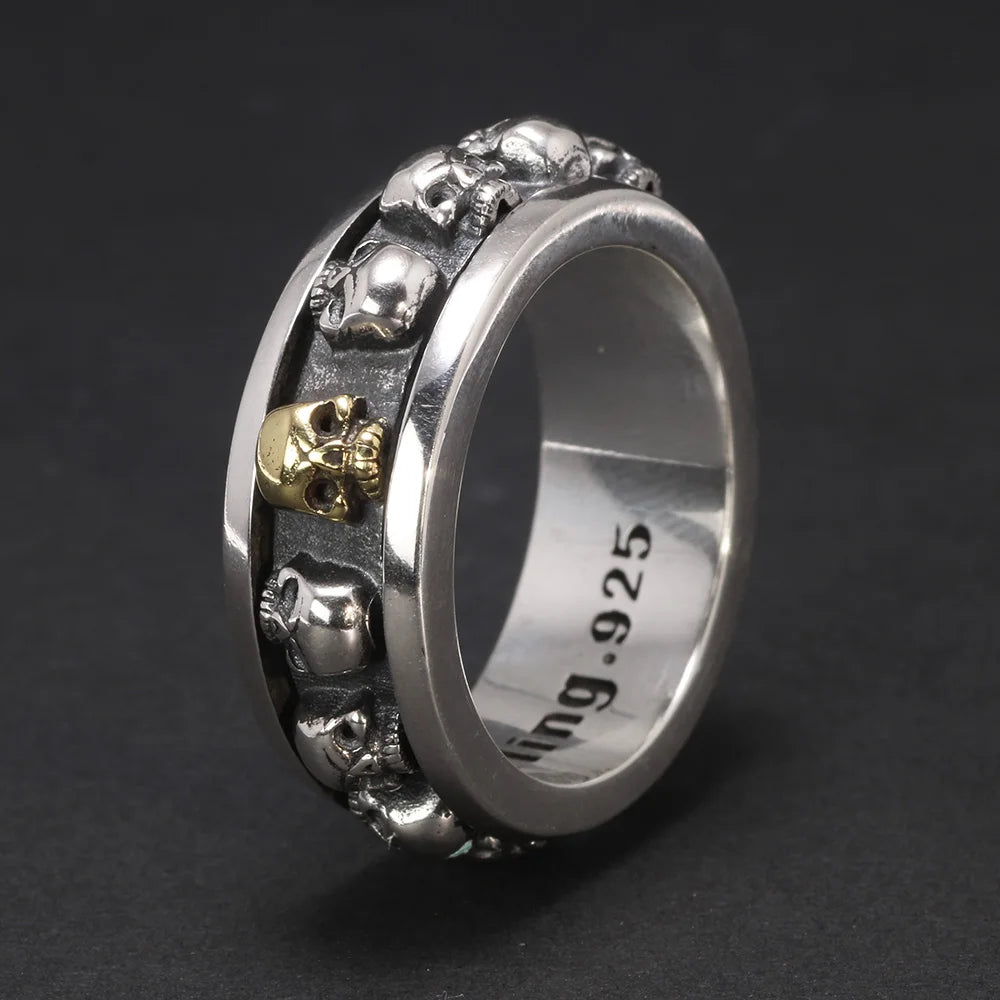 Men’s 925 sterling silver skull spinner ring with gold accent
