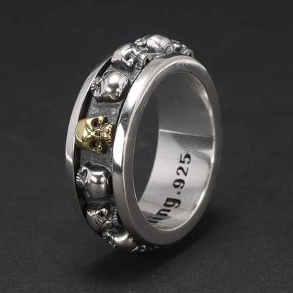 Men’s 925 sterling silver skull spinner ring with gold accent