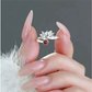 Minimalist lotus ring displayed in hand