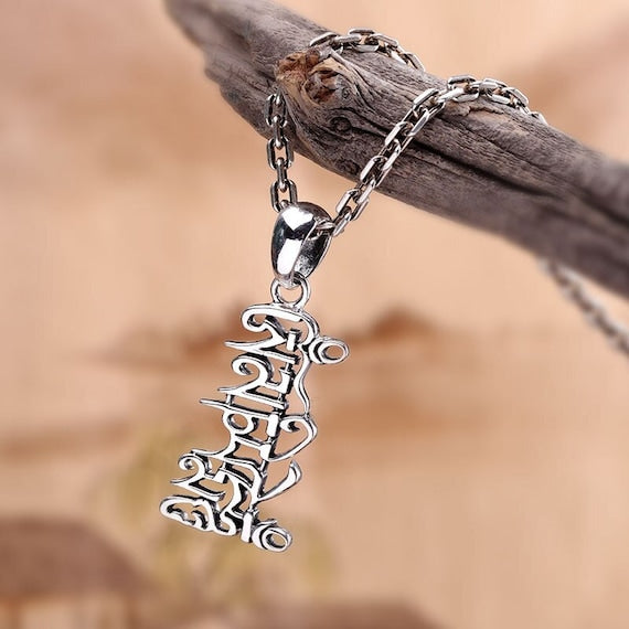 OM Tibetan pendant with intricate design