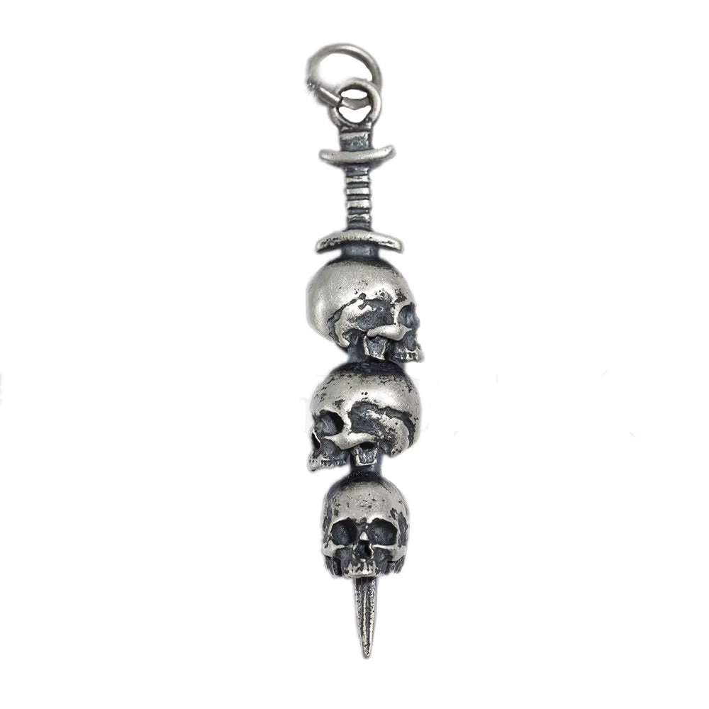 Sterling silver 3 skulls on sword pendant white background 
