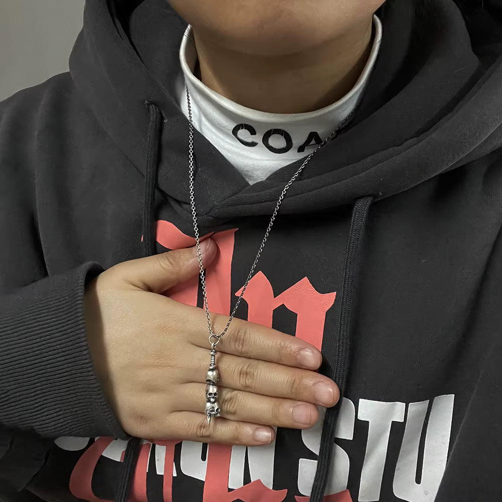 skulls sword pendant necklace on model