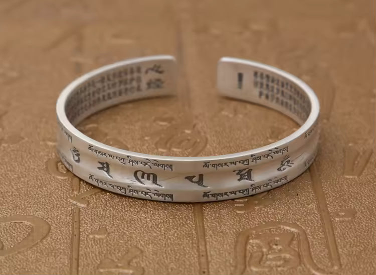 S999 silver spiritual bracelet worn on hand close up
