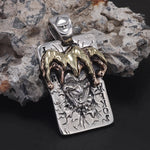 Silver joker pendant with gold and copper jester hat