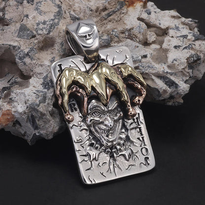 Silver joker pendant with gold and copper jester hat