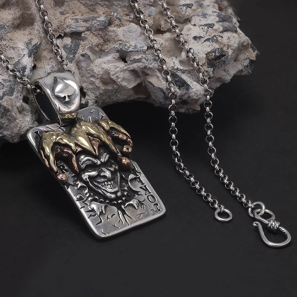 Silver joker pendant necklace with gold and copper jester hat