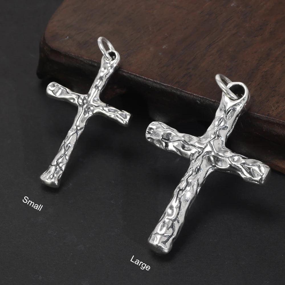 Small and large textured sterling silver cross pendants side by side