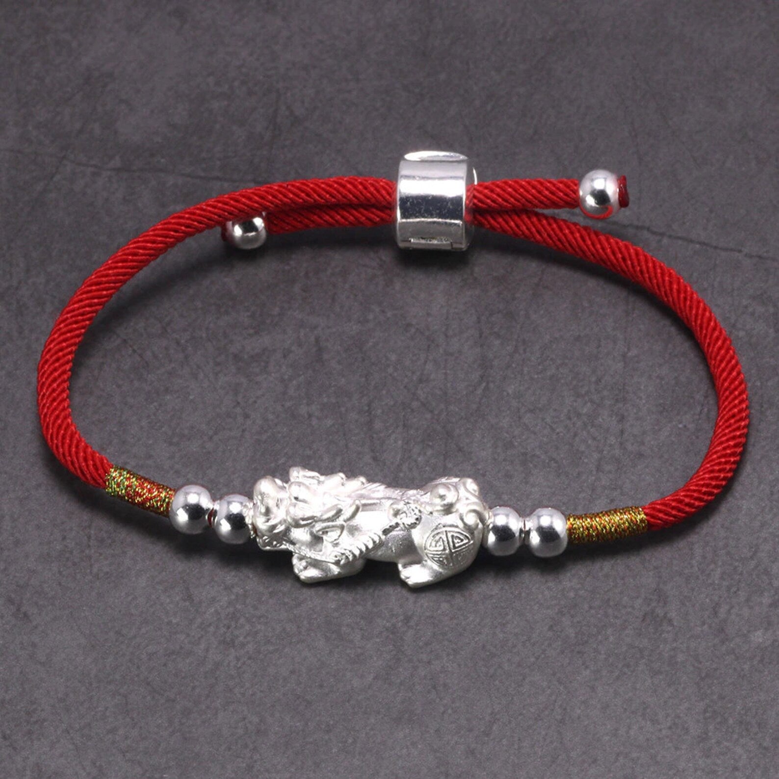Sterling Silver pixiu charm red bracelet detailed closeup