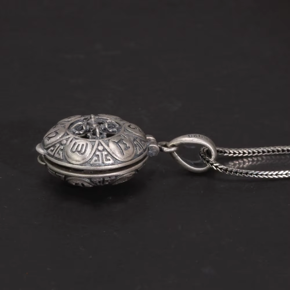 Sterling silver Buddhist locket pendant side angle