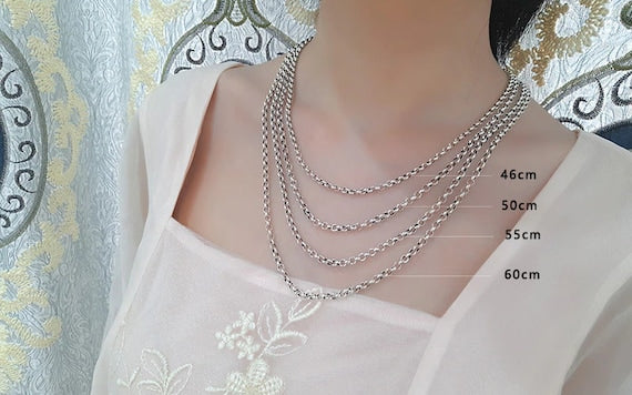 Sterling silver Rolo chain necklace on neck