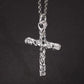 Sterling silver cross pendant hanging from a chain, front view