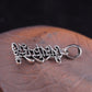 Sterling silver pendant with Tibetan symbols