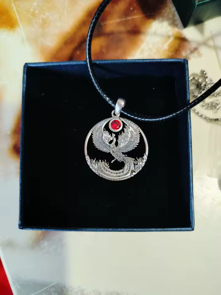 Sterling silver phoenix jewelry displayed in bx