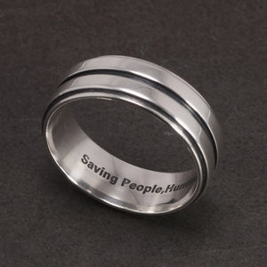 Supernatural engraved quote band ring front profile on display