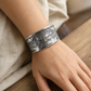 Woman wearing a 999 silver lotus bangle on her wrist