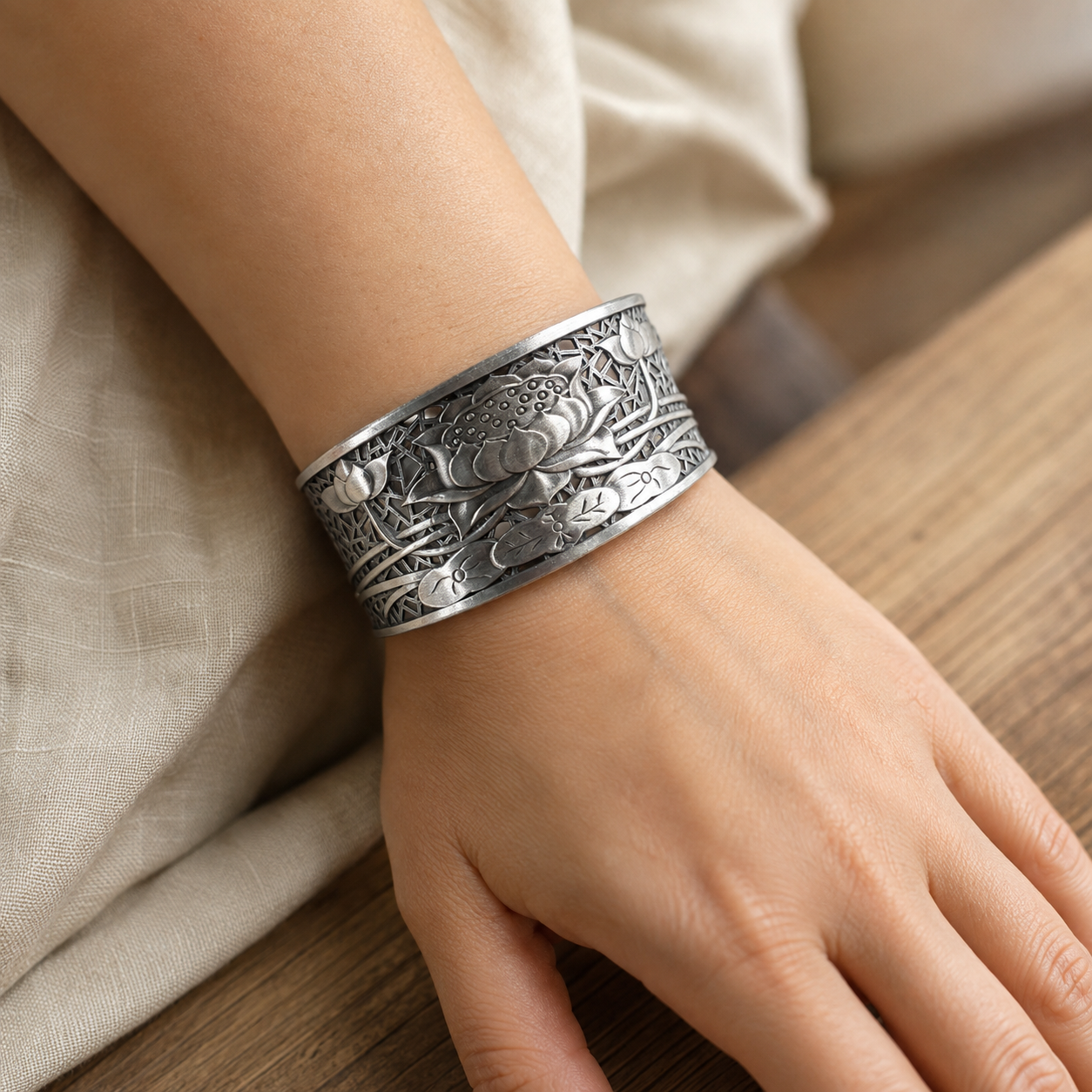 Woman wearing a 999 silver lotus bangle on her wrist