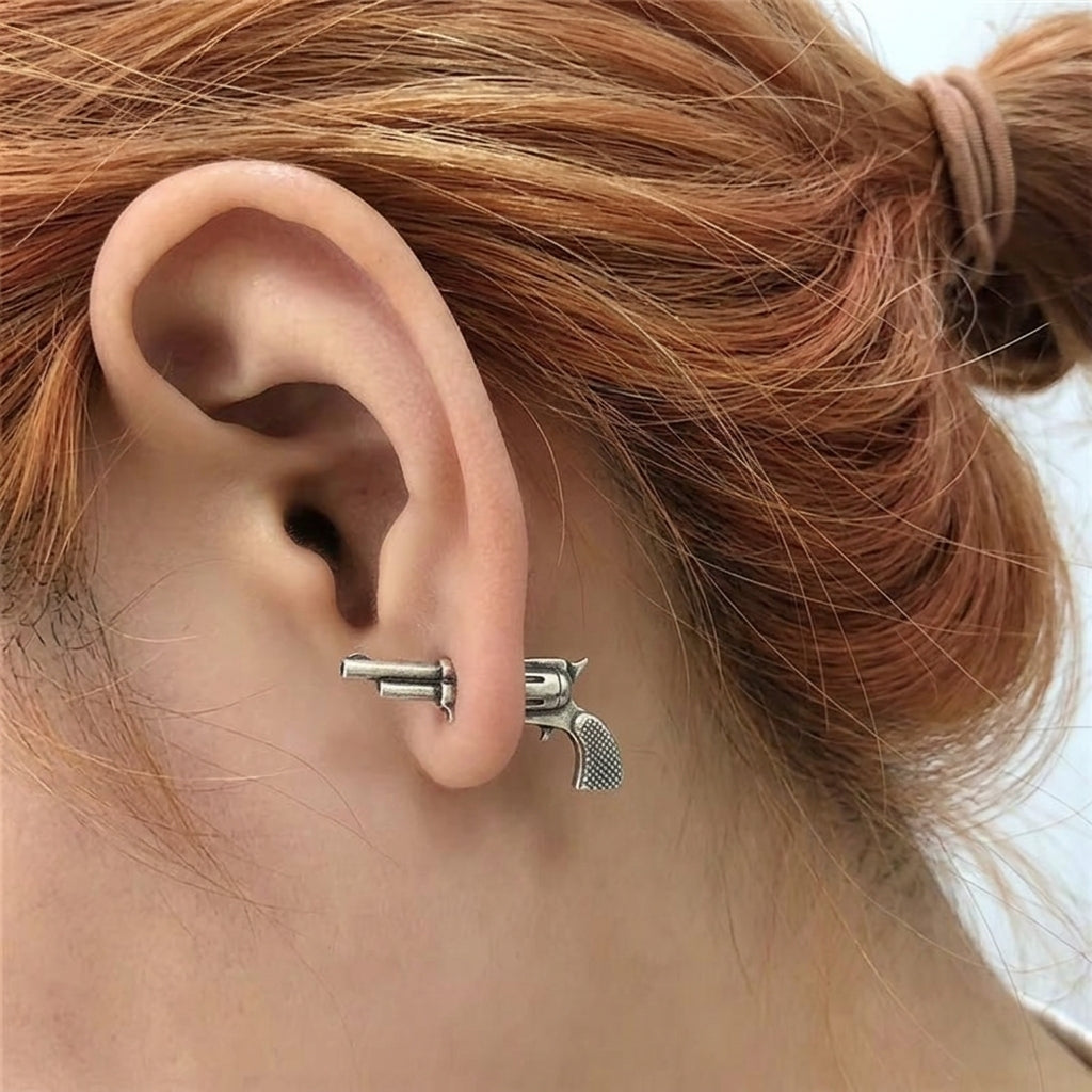 Woman wearing two part sterling silver pistol stud earring in lobe piercing