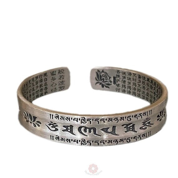 adjustable buddhist silver cuff bracelet front detail image