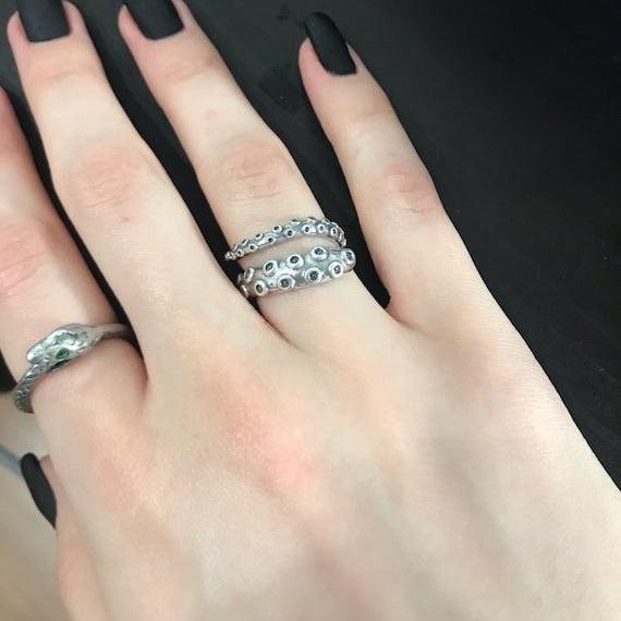 adjustable octopus tentacle ring worn on hand