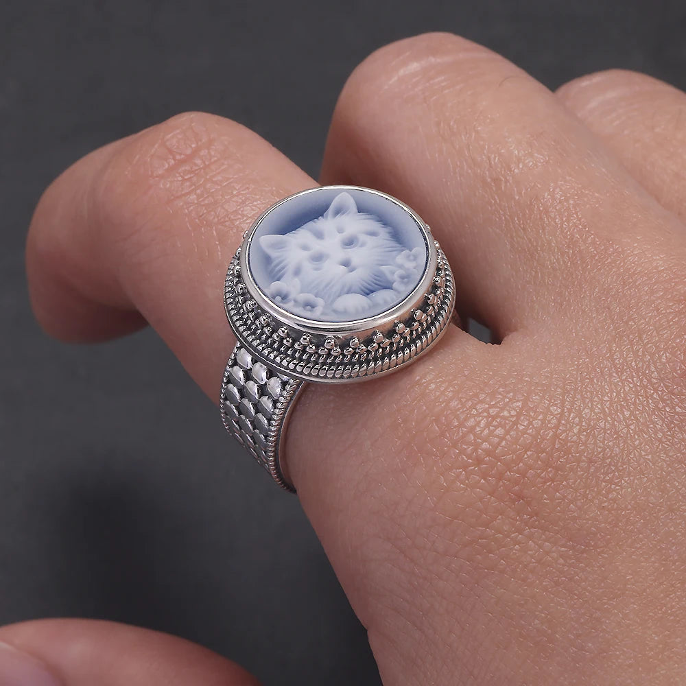 blue agate cameo ring on hand photo