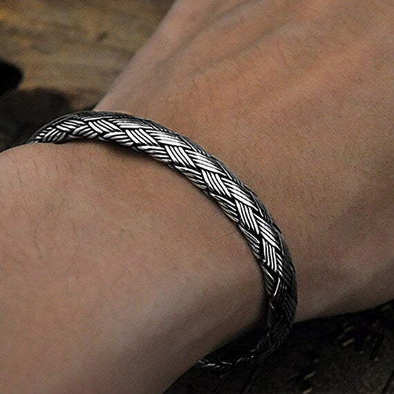 braided sterling silver cuff bracelet on wrist